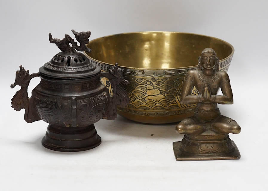 A Chinese bronze censer and cover, a Chinese bronze bowl and an Indian bronze seated deity, tallest 19cm high. Condition - fair some general scuffs and wear, the figure has a chip